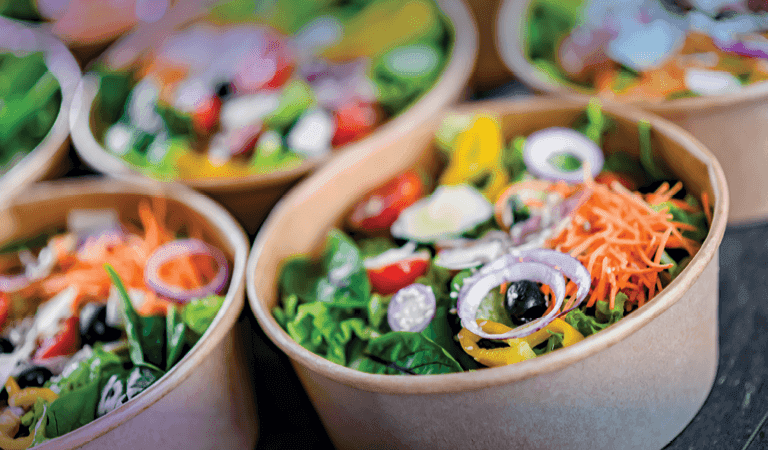 salad in paper takeaway bowls